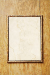 Old photo frame with a stained paper