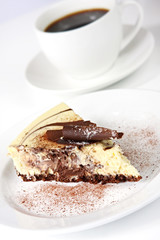 Chocolate cheesecake with a cup of coffee.  Delicious!