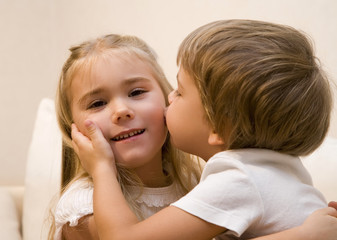 Little boy kiss his sister  