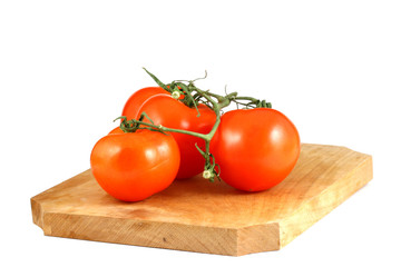 three tomatos with a bit of shadow isolated on white