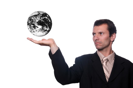 businessman holding earth with polution and war efects