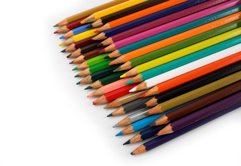 Assortment of coloured pencils with shadow on white background