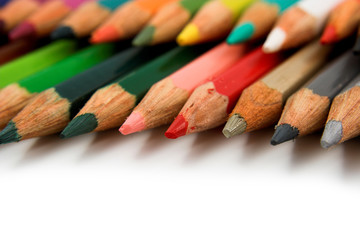 Obraz premium Assortment of coloured pencils with shadow on white background