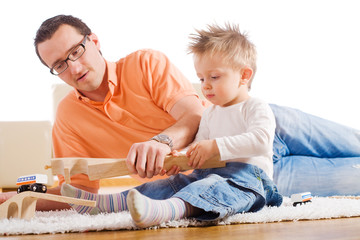 Father and child playing