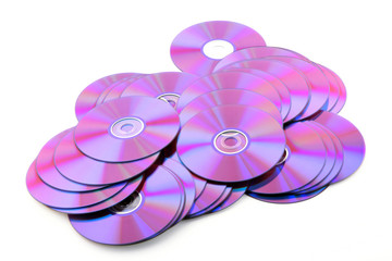 Pile of colorful purple DVDs or CDs. No dust.