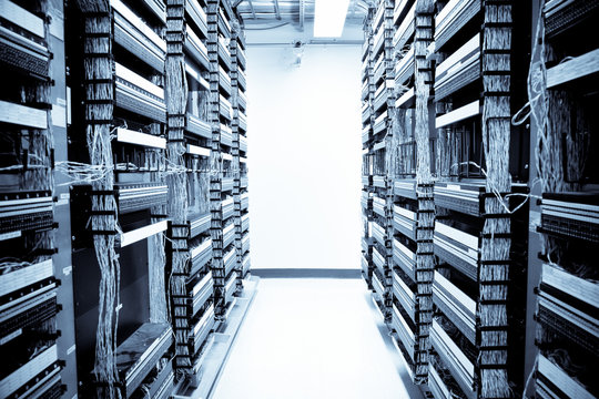 A shot of servers and hardwares in an internet data center - Powered by Adobe
