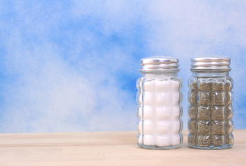 Salt and Pepper Shaker on Blue Background