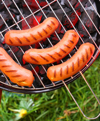 Sausages on a grill