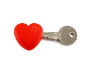 silver key is inserted into red heart