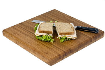 A fresh deli sandwich with lots of meat and green lettuce
