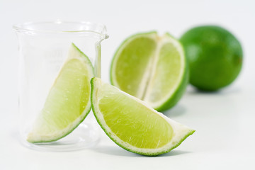 Green setup with lime slices, half and whole fruit