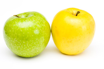 Fresh green and yellow apples at white background
