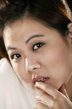 Portrait Of Asian Girl Holding Her Mouth