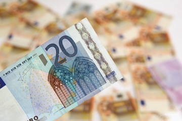 twenty euro banknote on background of money