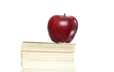 Red apple and stack of books 