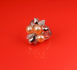 Jewelry pearl ring  on red