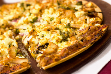 Three cheese pizza on a platter