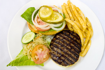 Open burger served with fries and coleslaw
