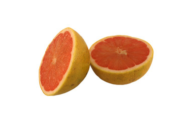 Isolated pink grapefruit halves on white
