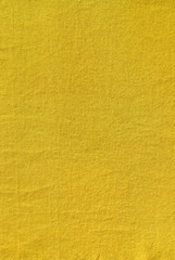 Fototapeta premium Yellow colored plain cotton linen as background