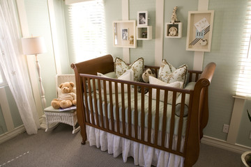 Baby bedroom with a crib, toys and decor.