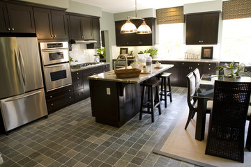 Kitchen with a tile floor and breakfast table.