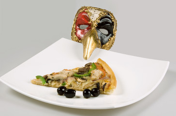 pizza with olives and italian mask