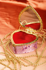 Casket and a golden necklace