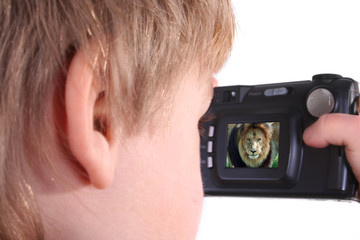 Isolated photo of young boy taking a photograph