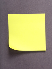 Yellow note over grey background