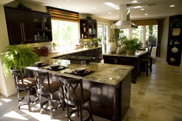 Luxury kitchen with a granite breakfast counter.