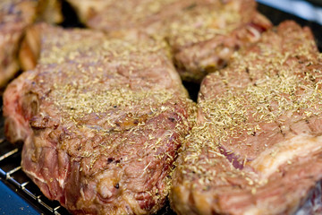 Cooking barbecue steak with herb and spice