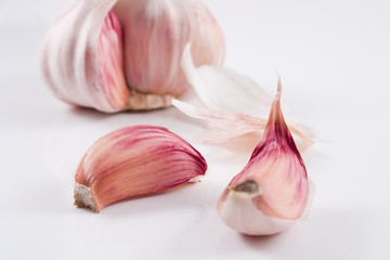 Obraz na płótnie Canvas Garlics over a white background