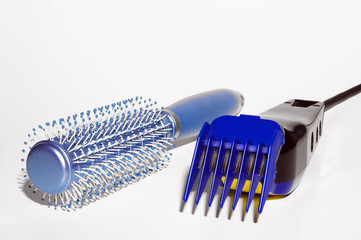 A hairbrush and a set of hair clipping shears.