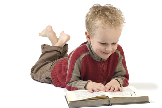 5 Year Old Reading A Book, Isolated On White. 