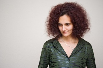 Portrait of a pretty redhead woman with curly hair