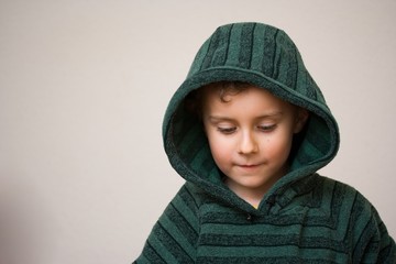 Portrait of a beautiful child wearing a green sweater
