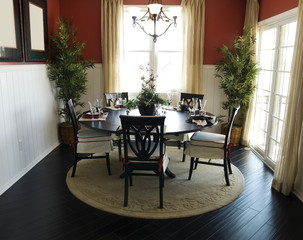 Elegant Forming Dining Area with hardwood flooring