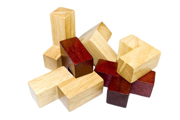 Wooden cube puzzle elements isolated on white
