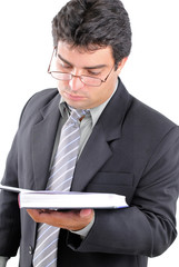 Young Man reading and holding an book .