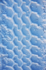 wheel tracks in snow, very cold feel to the photo