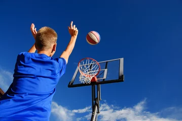 Foto op Canvas Boy playing basketball © Marzanna Syncerz