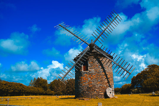 windmill in a green field in Britany (France)