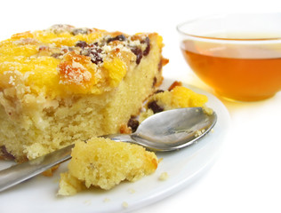 Slice of pie with raisins on white background