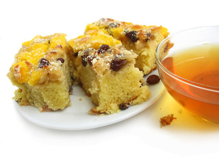 Slice of pie with tea on white background