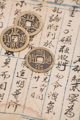 antique chinese book page and coin for background