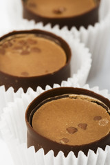 three chocolate sweet candies vertical