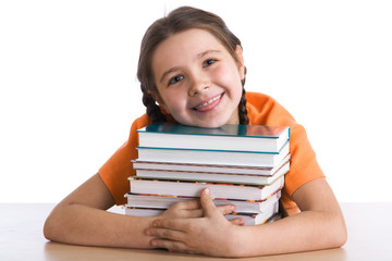 Young schoolgirl with a pile of books..