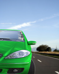 Green car on the road