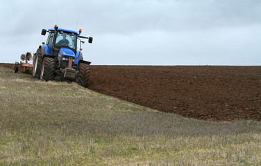 Obraz premium Ploughing the slope
